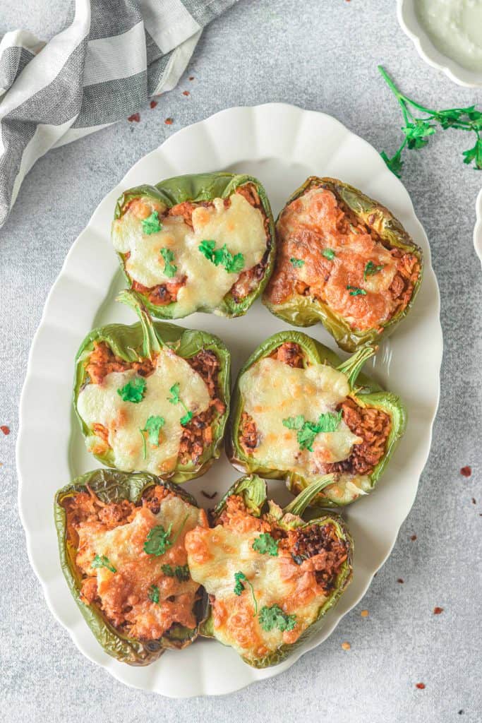 Overhead view of stuffed bell peppers.