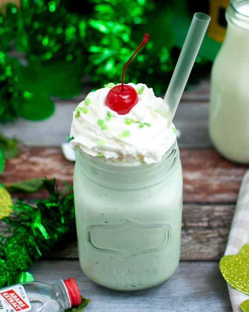 Mint milkshake with whipped cream and a cherry on top