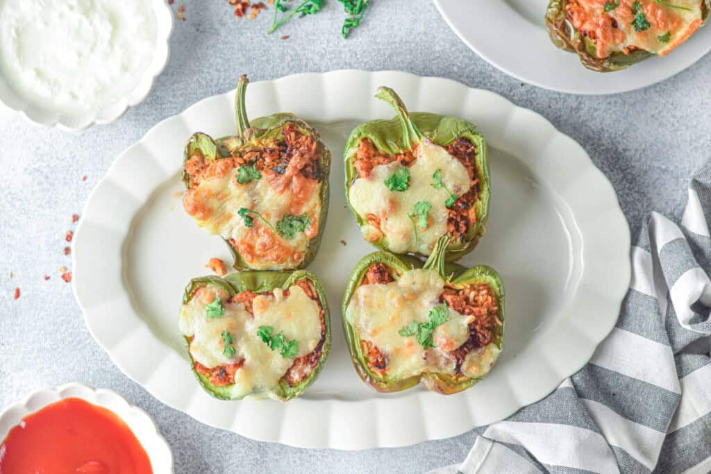 Overhead view of stuffed bell peppers.