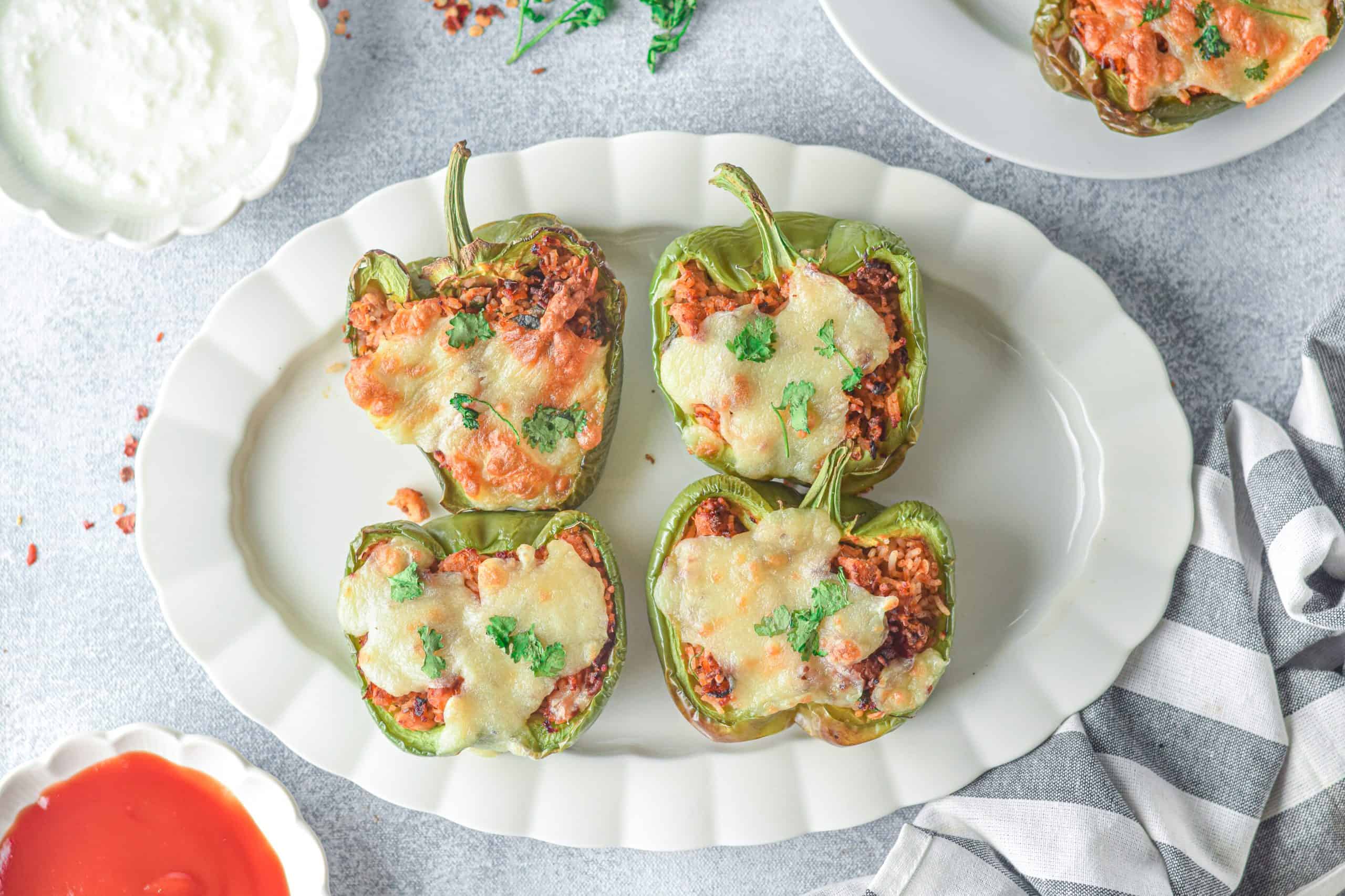 Overhead view of stuffed bell peppers.