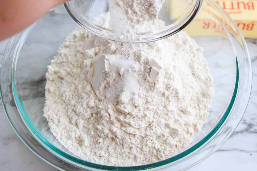 Flour and sugar in a glass bowl.