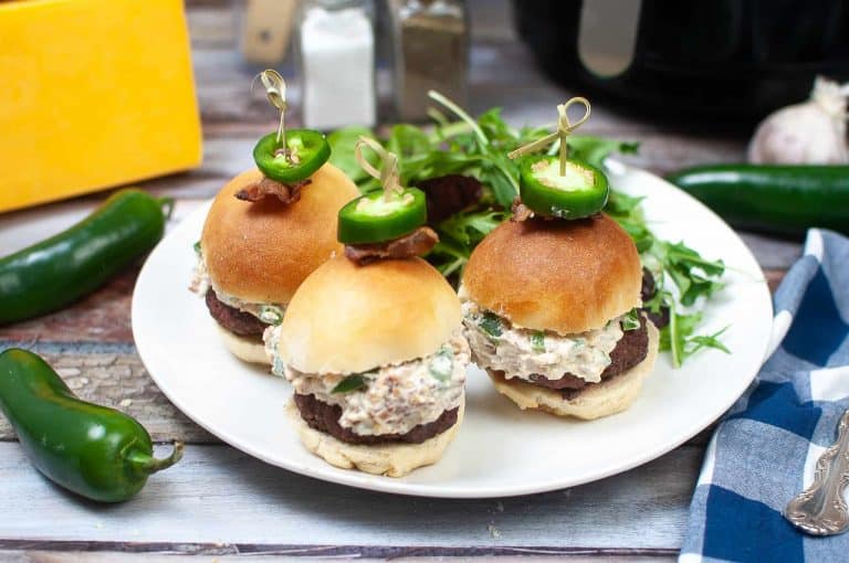 Jalapeno sliders on a white plate.