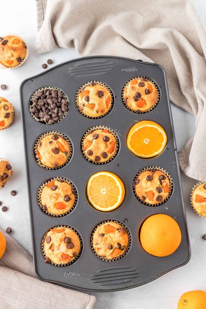 Orange chocolate muffins in a tin.
