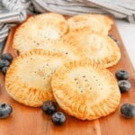 Air Fryer Blueberry Hand Pies on a Cutting Board.