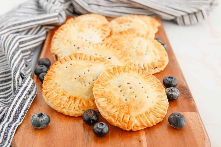 Air Fryer Blueberry Hand Pies on a Cutting Board.