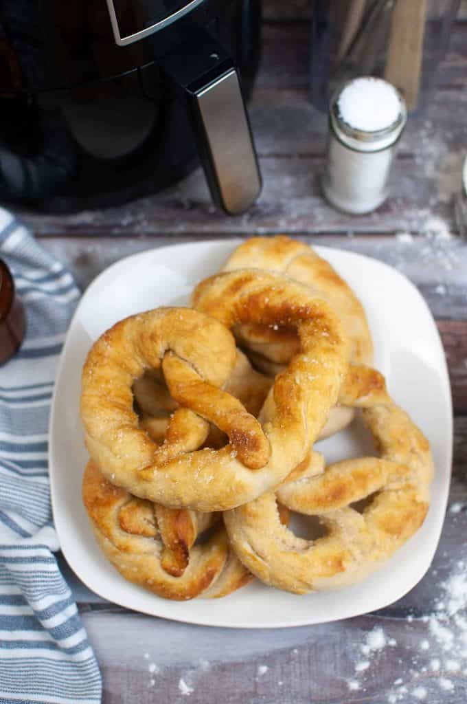 Air fryer soft pretzels on a white plate.