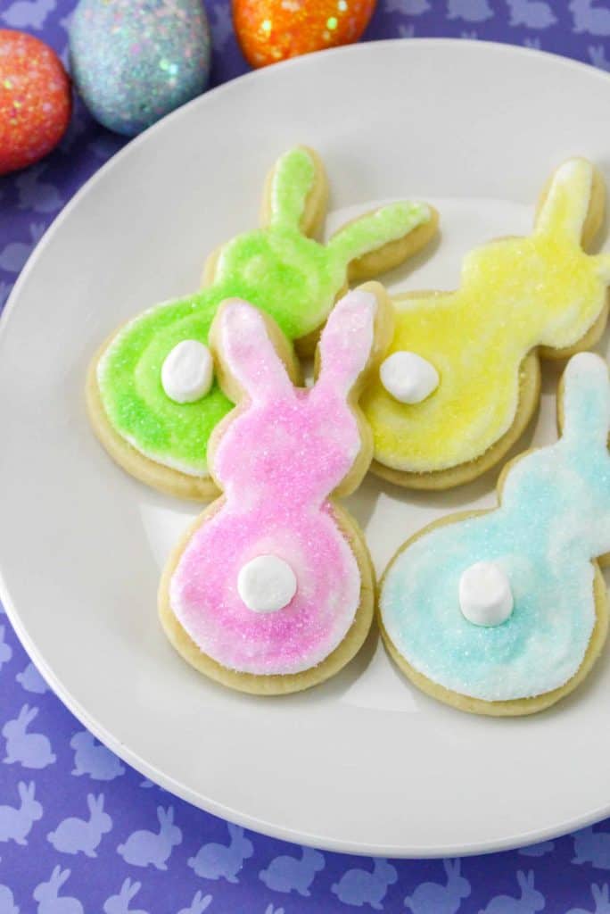 Bunny tail cookies on a white plate.