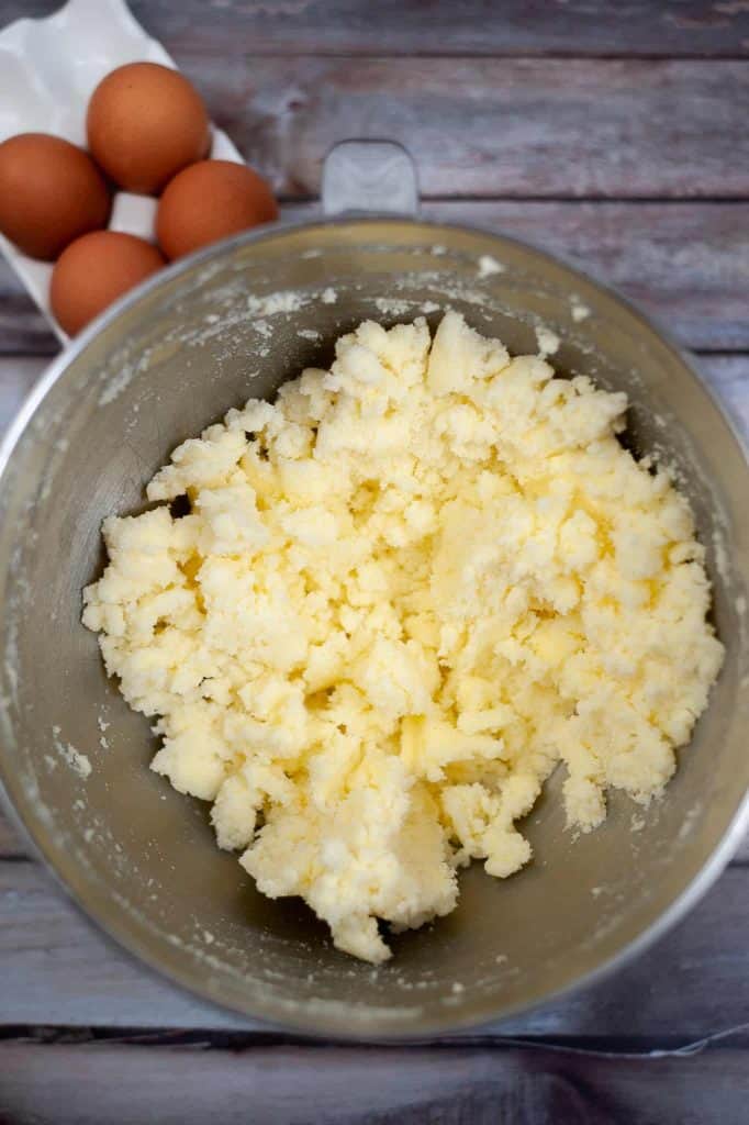 Butter in a stainless steel mixing bowl.