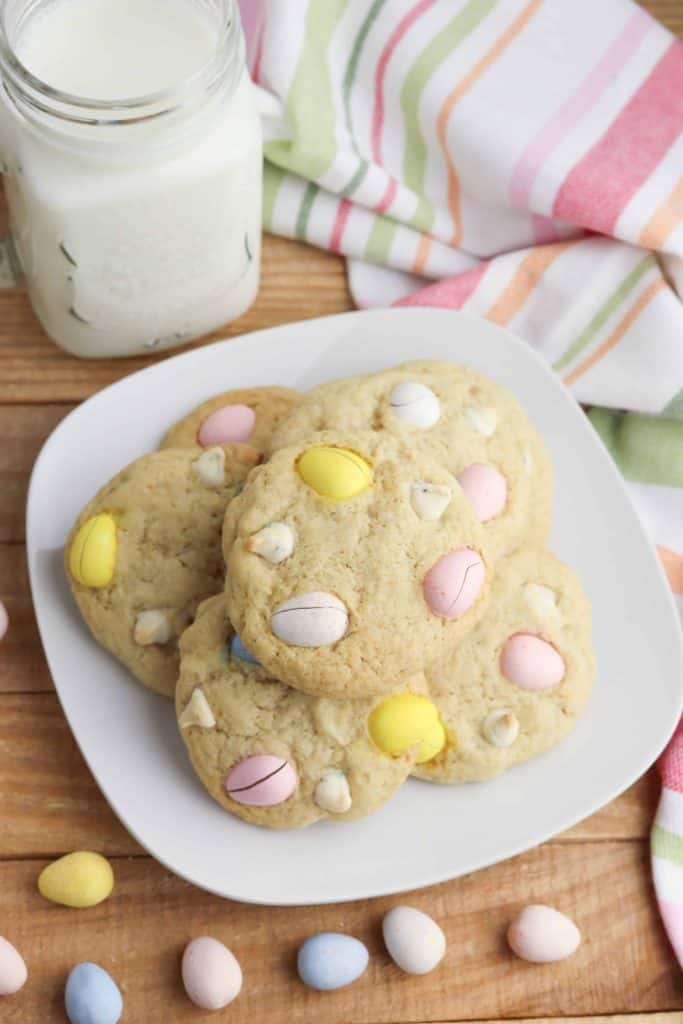 Cadbury mini eggs cookies on a white plate.