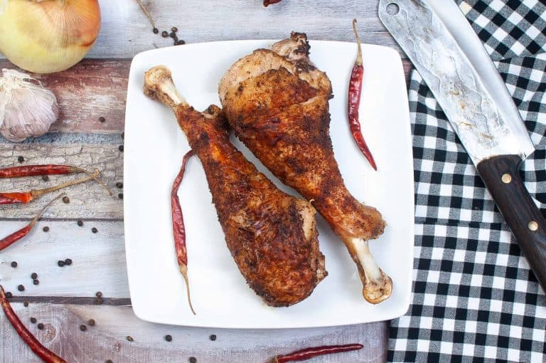 Overhead view of air fryer turkey leg.