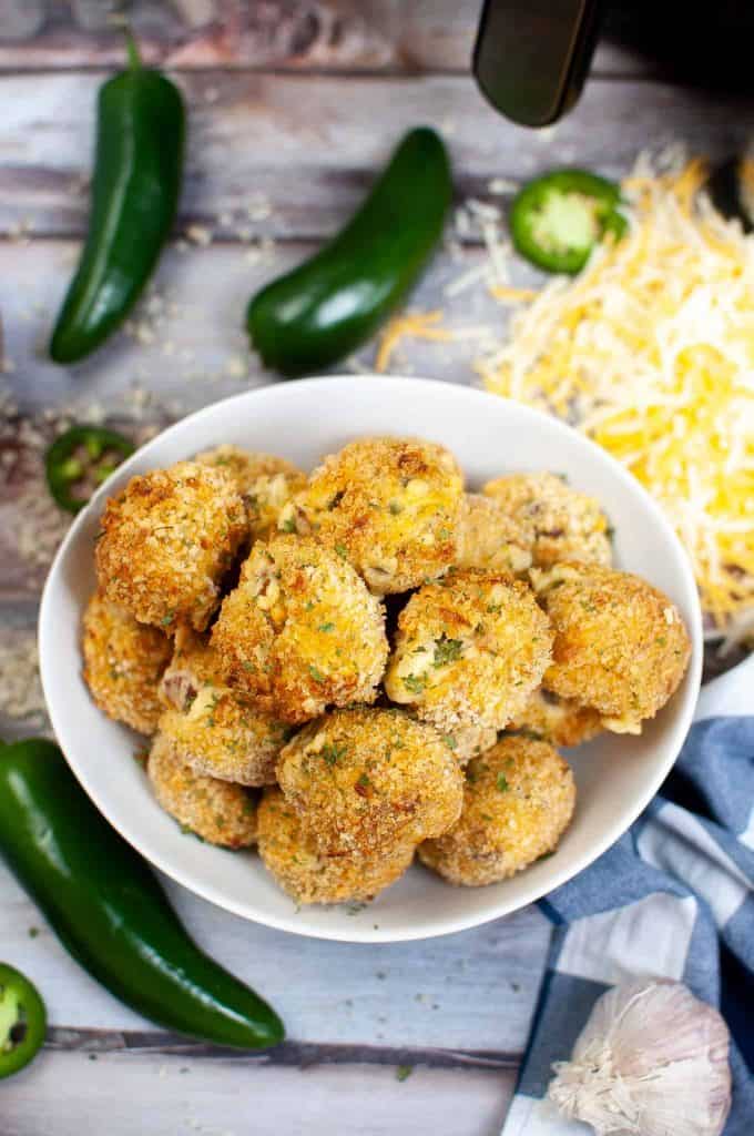 Overhead view of jalape&ntilde;o popper bites in the air fryer.
