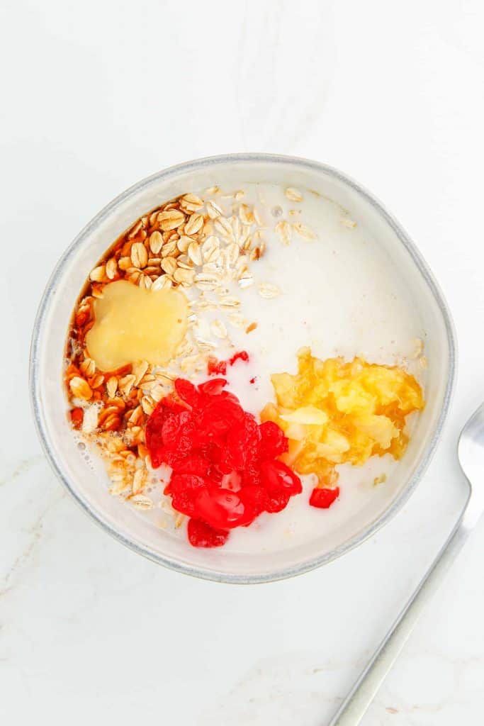 Preparing overnight oats with pineapple.