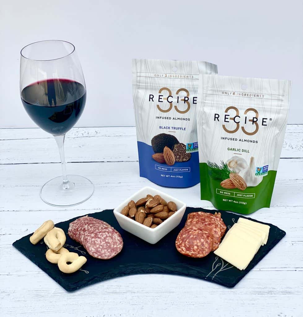 Charcuterie, red wine and RECIPE 33 almonds.