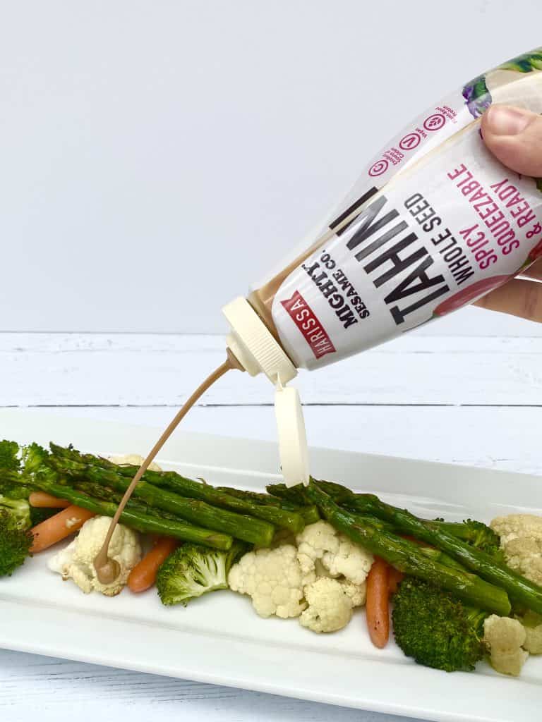 Squeeze tahini on vegetables.