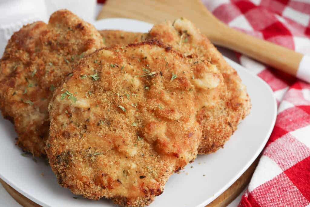 Air Fryer Pork Chops on a white plate.