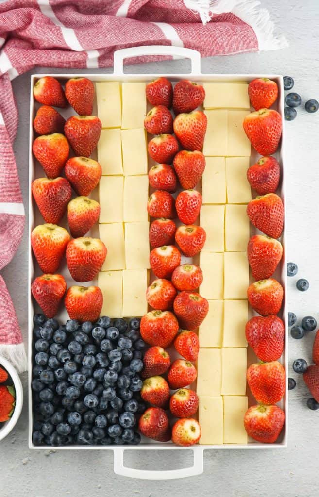 Overhead view of fruit and cheese flag.