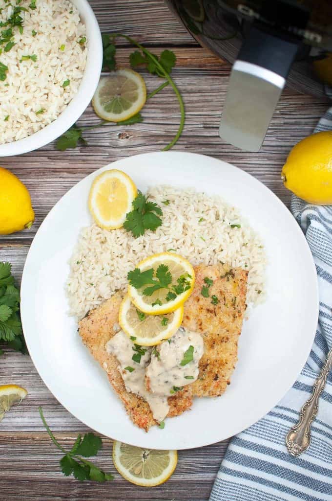 Overhead view of air fryer parmesan crusted salmon