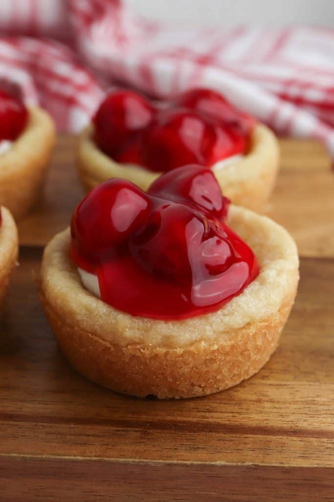 Head-on view of cherry cheesecake cookie cups
