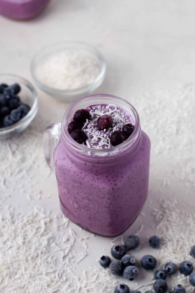 Blueberry banana smoothie in a glass.