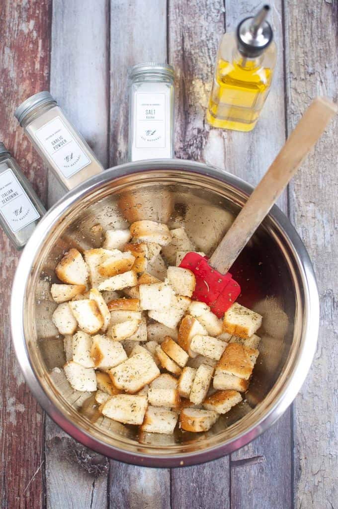 Bread cubes seasoned in bowl.