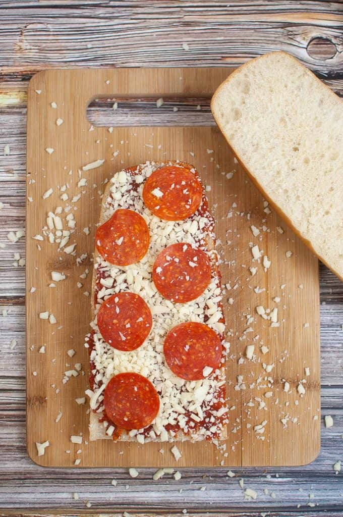 Uncooked French Bread Pizza with Pepperoni and Cheese.