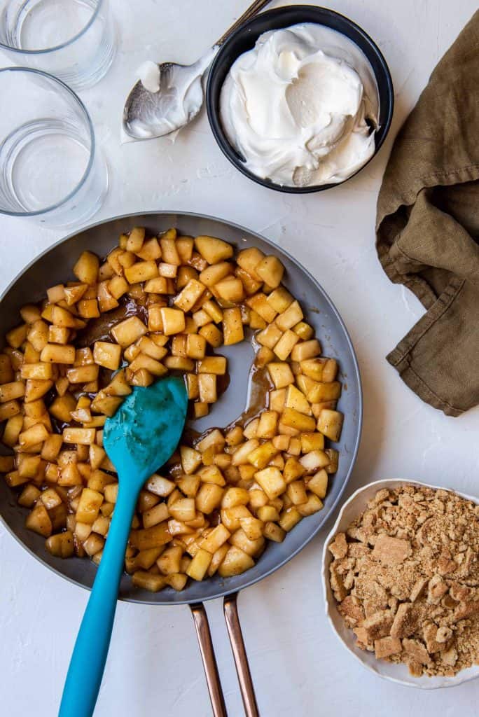 Homemade apple pie filling, crushed graham crackers and whipped cream.