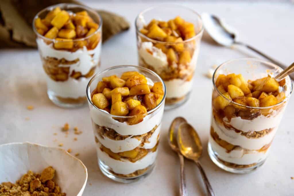 4 No Bake Apple Pie Parfaits with spoons.