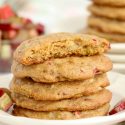 Stack of rhubarb cookies with a bite out of the one on top.