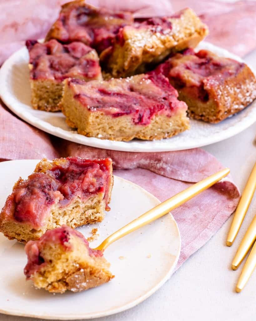 Overhead view of strawberry upside down bars with a gold spoon.