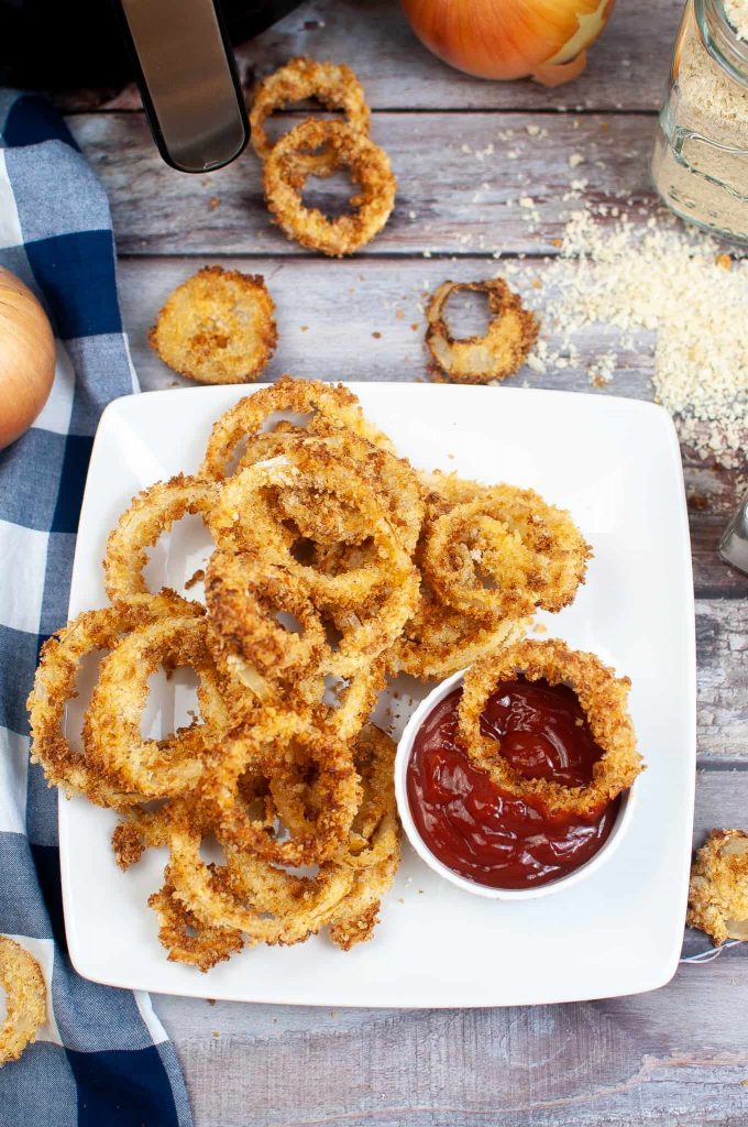 Overhead view of fried onions on a plate.