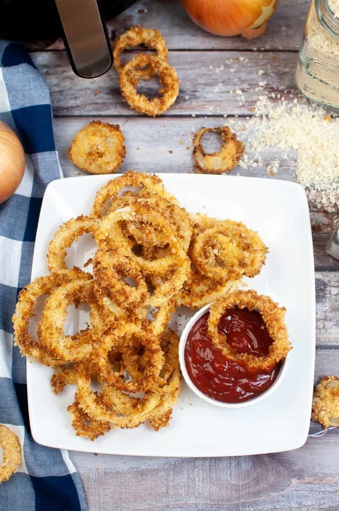 Overhead view of fried onions on a plate.