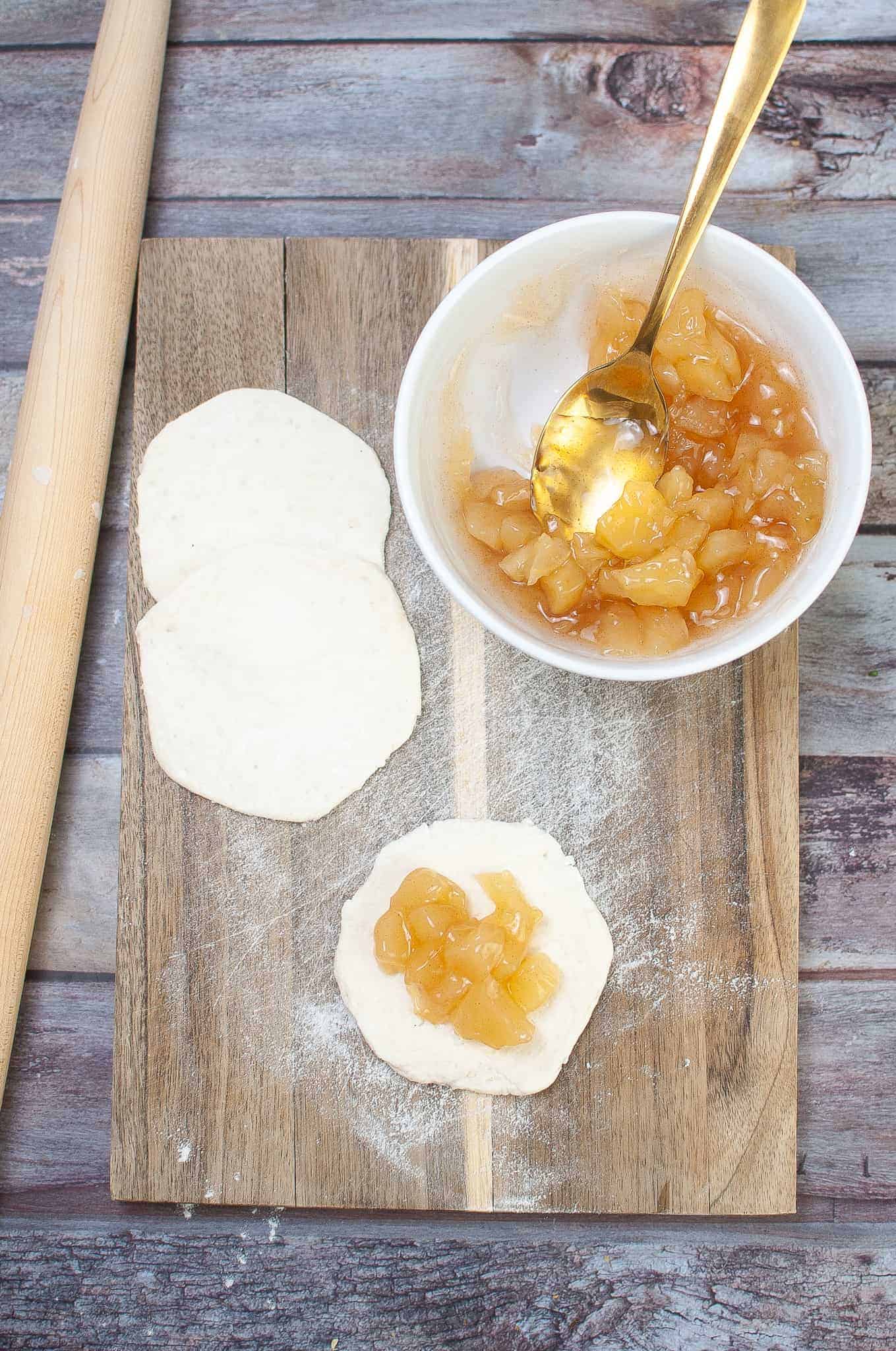 Apple pie filling on biscuit dough.