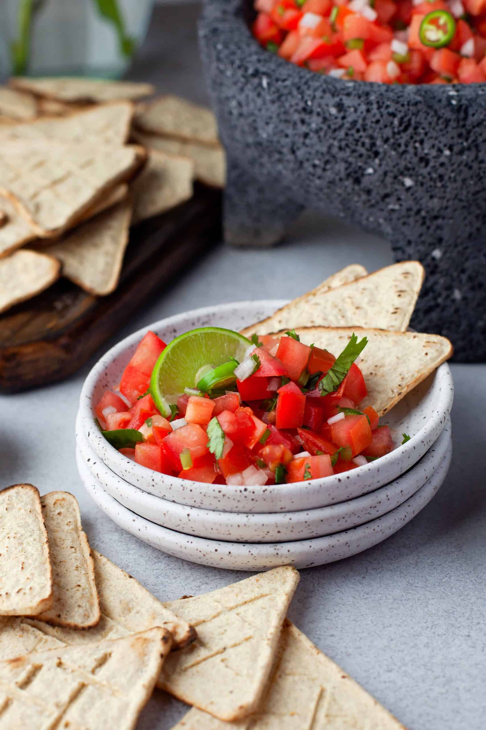 Salsa fresca with chips in serving bowl.