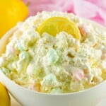 Lemon Fluffy Salad with a lemon slice on top.