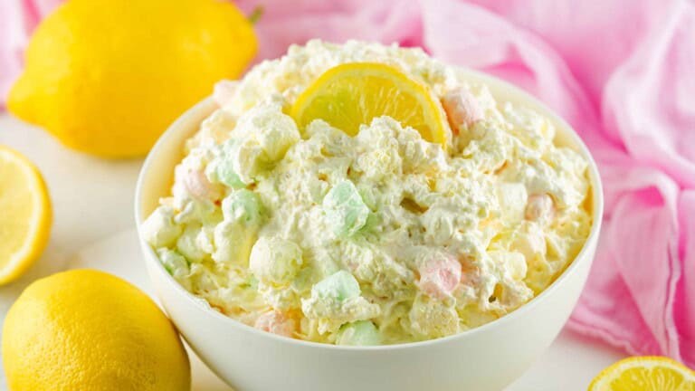 Lemon Fluffy Salad with a lemon slice on top.