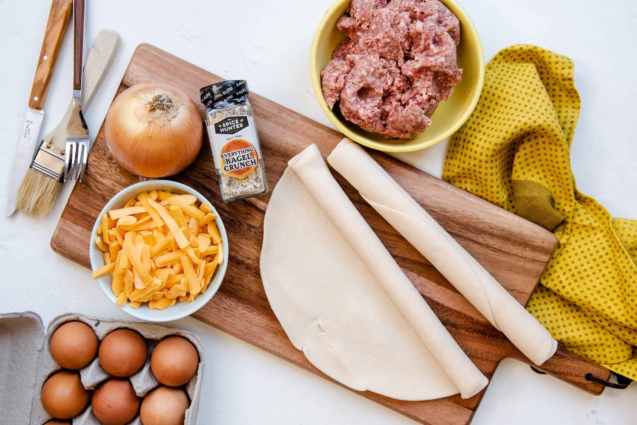 Overhead view of ingredients for savory breakfast hand pockets.