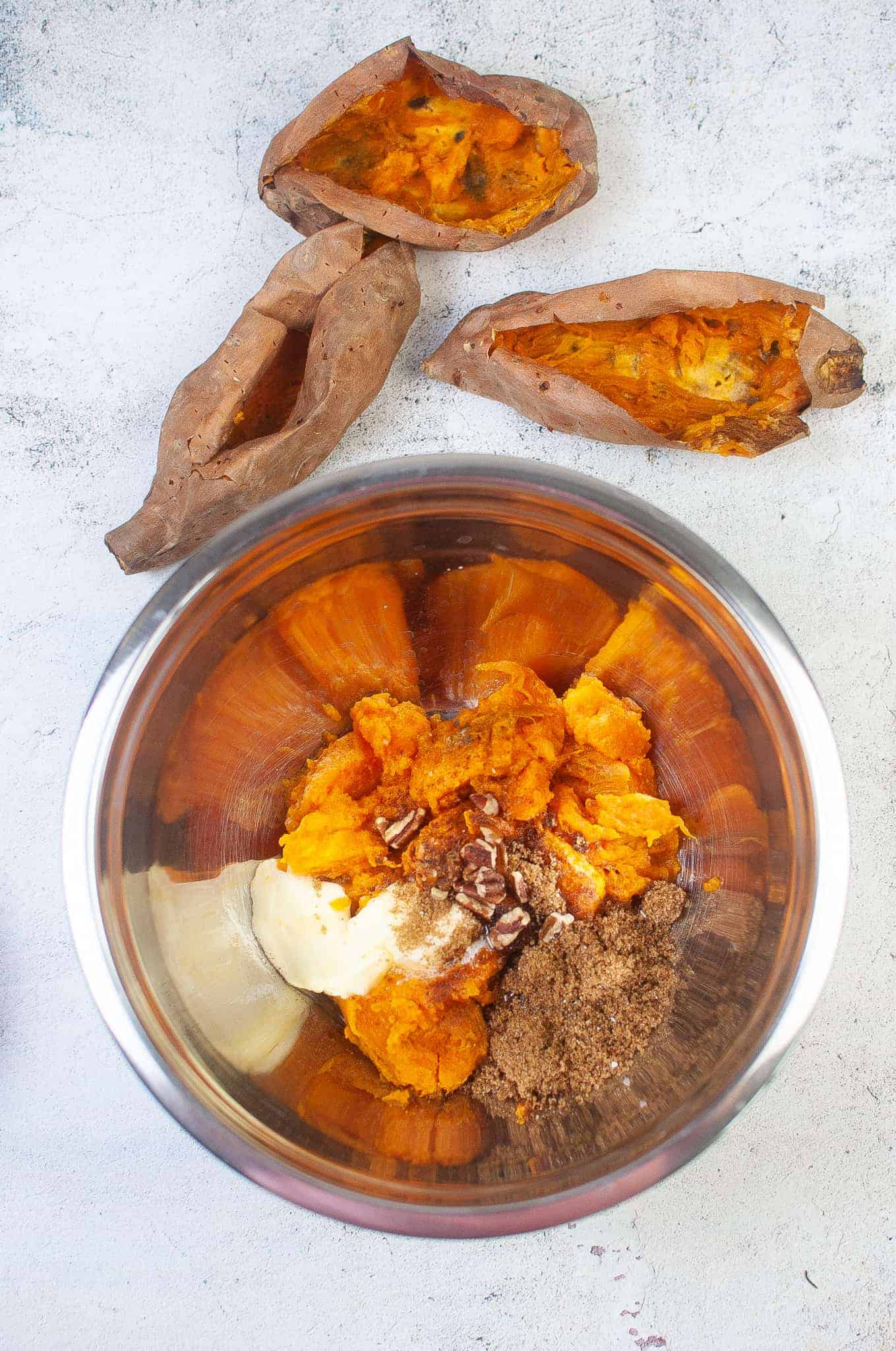 Making the filling for the sweet potatoes.