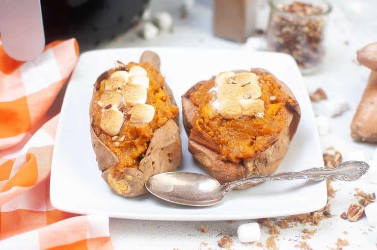 Air fryer stuffed sweet potatoes on a white plate.