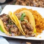 Air Fryer Carnitas Tacos on a white plate with rice.