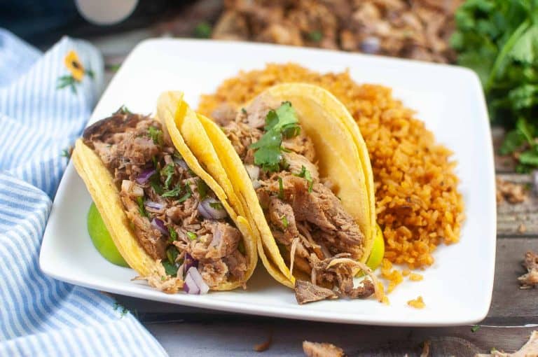 Air Fryer Carnitas Tacos on a white plate with rice.