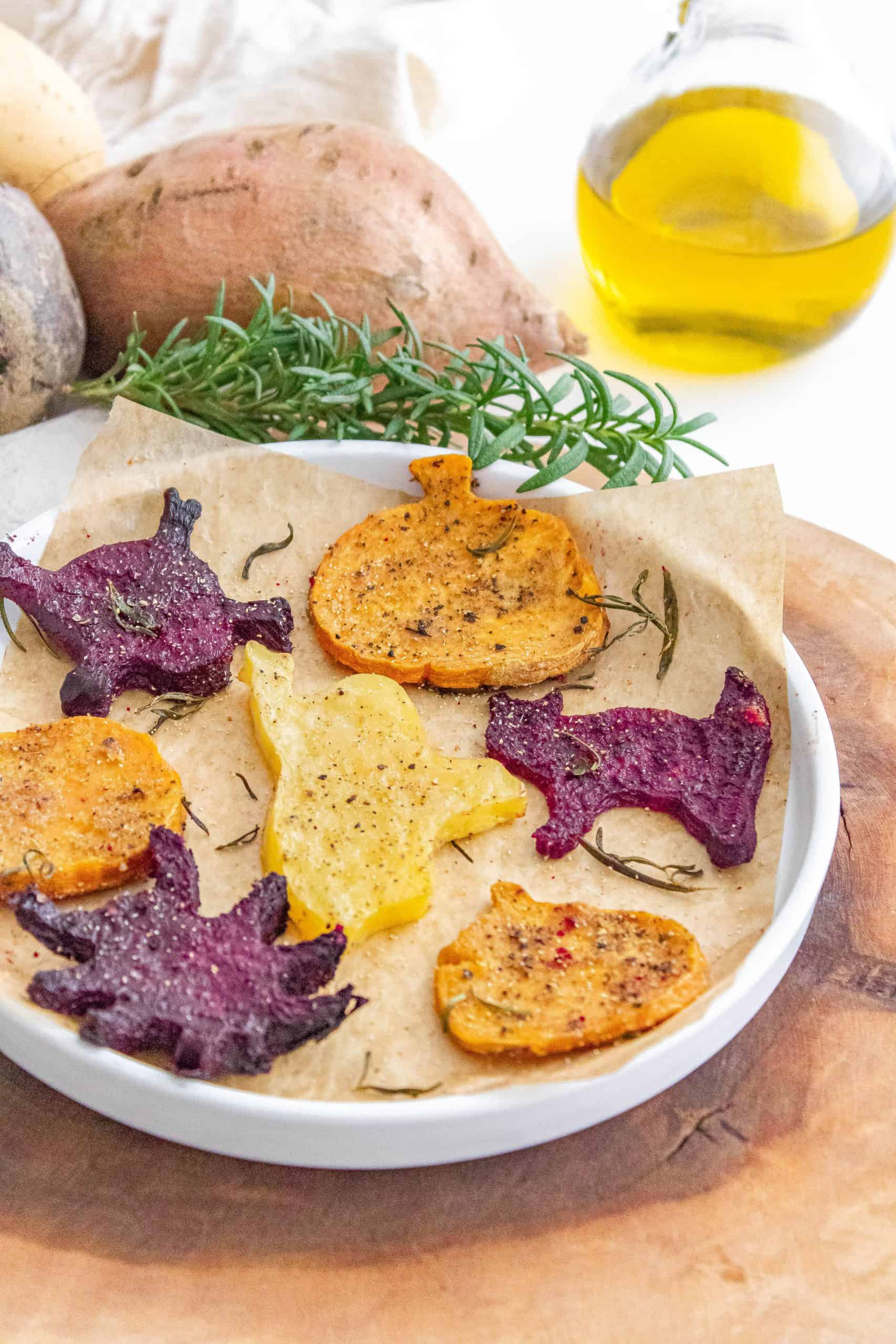 Halloween roasted vegetables with rosemary seasoning on a plate.
