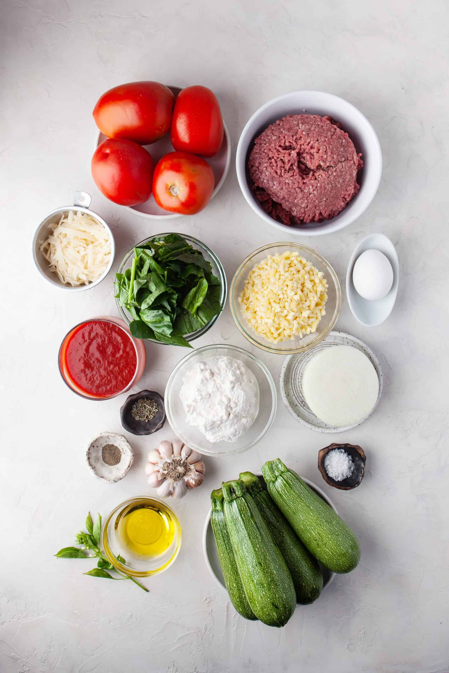 Overhead view of all ingredients used for zucchini lasagna rolls.