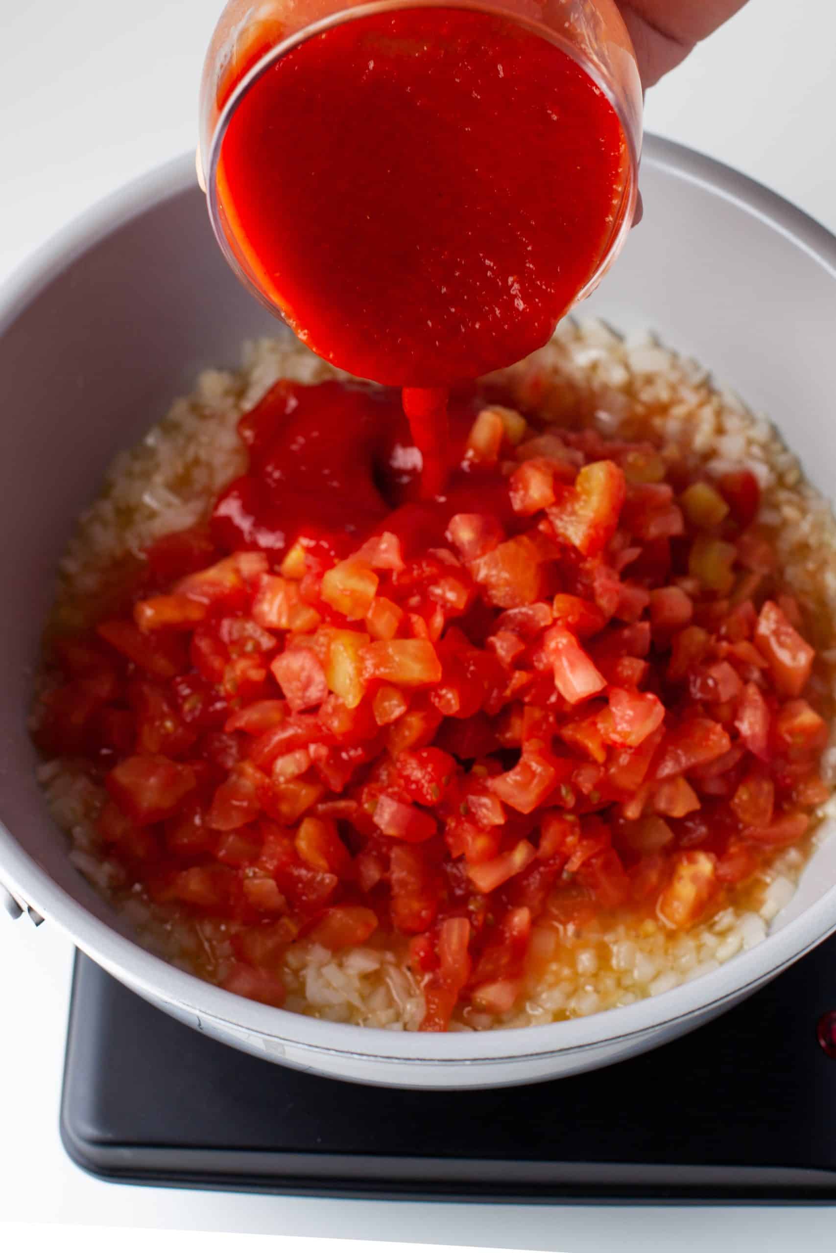 Preparing the tomato sauce.