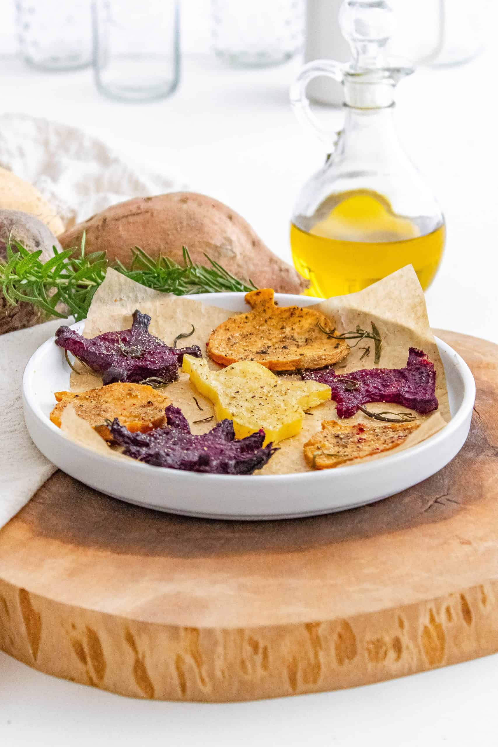 Plate of roasted Halloween vegetables on a white plate.