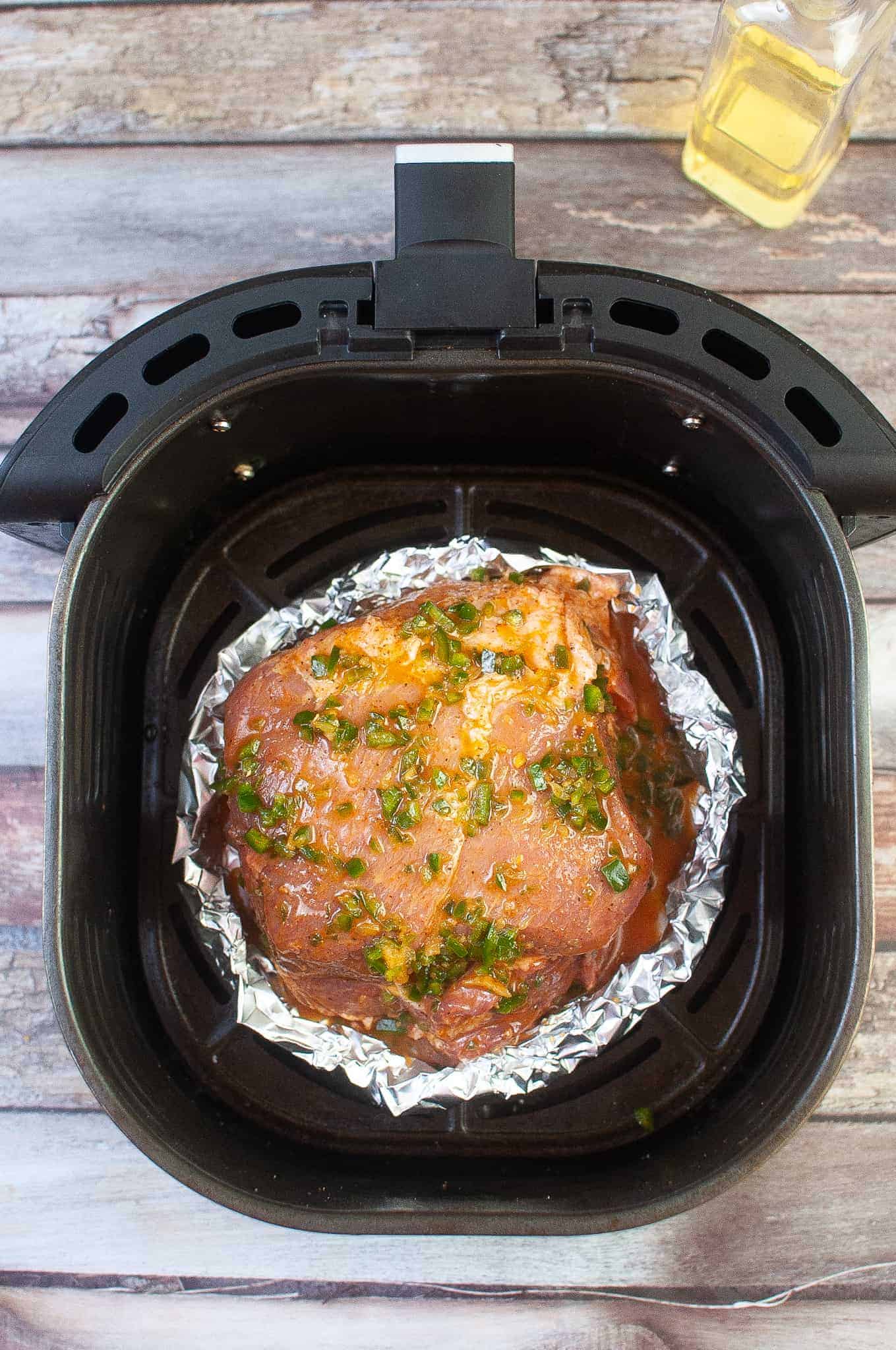 Pork Roast in Air Fryer basket.