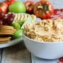 Bowl of pumpkin whip with fruit and cookie tray.