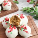 Overhead view of gingerbread balls, one with a bite out of it.