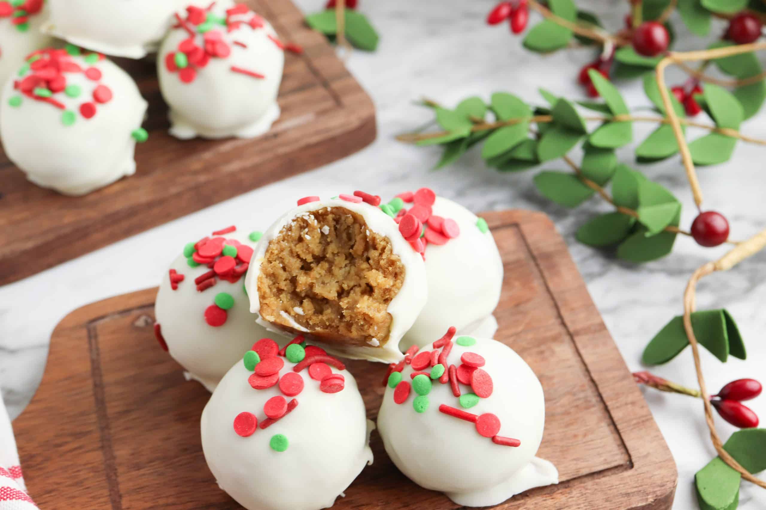 Overhead view of gingerbread balls, one with a bite out of it.
