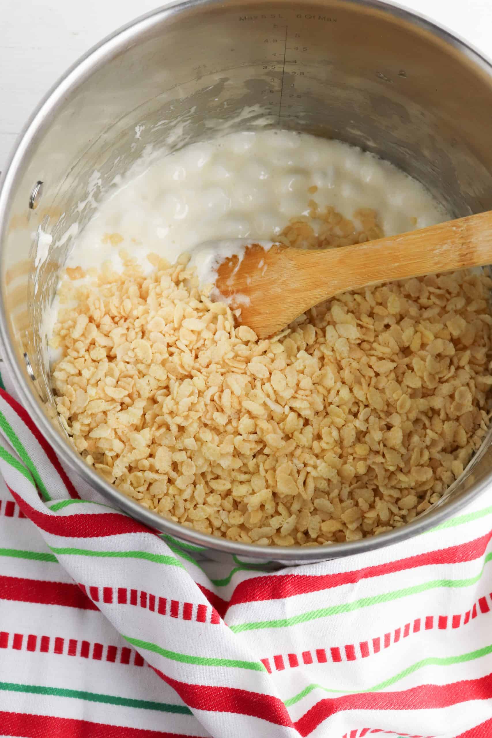 Rice krispies and marshmallows in a bowl.