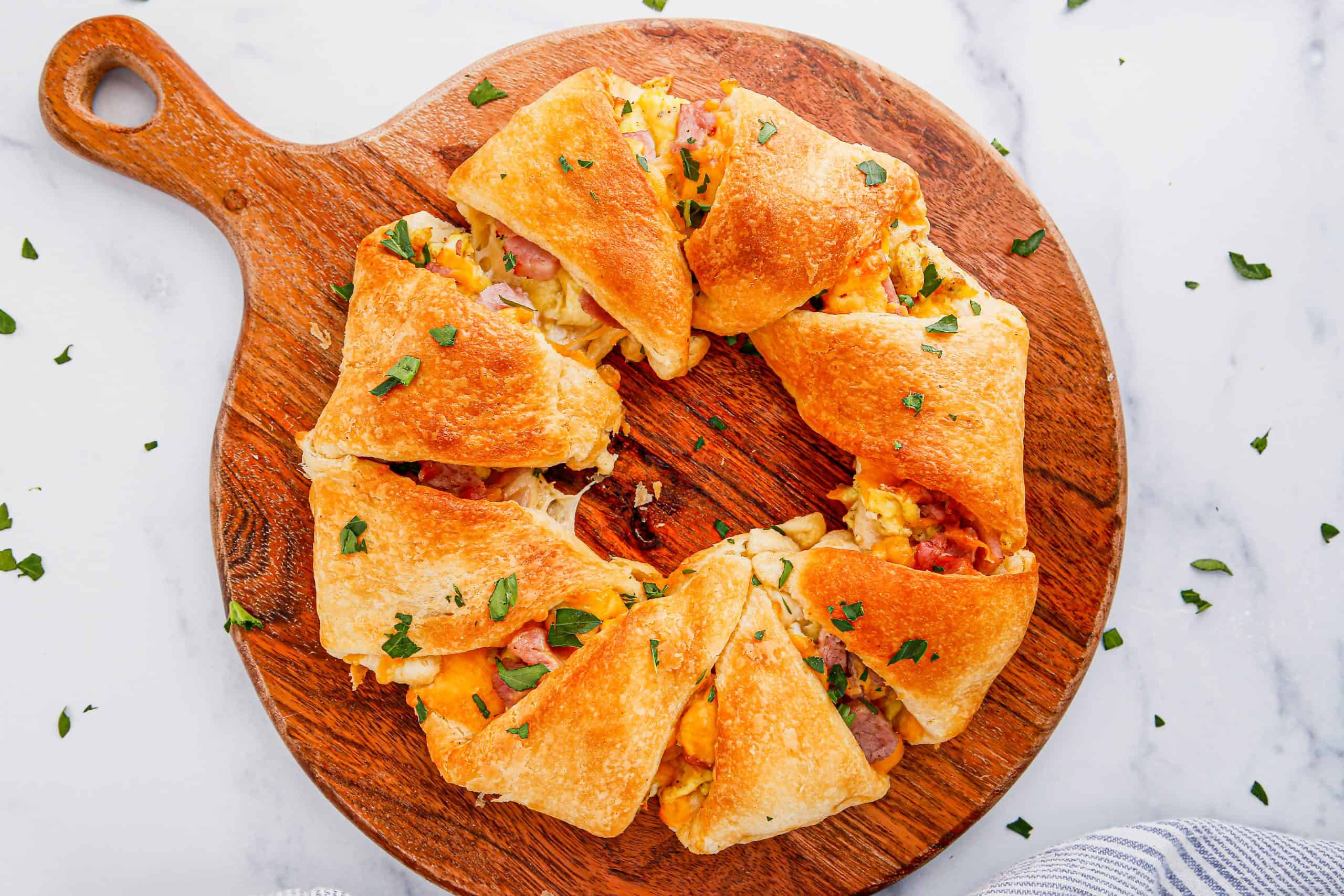 Overhead view of baked ham and cheese breakfast ring.